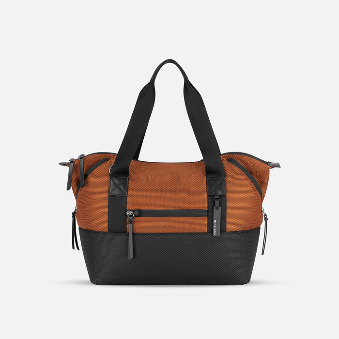 A Sherpani Eclipse Morocco Expandable Tote, front view showing lockable pocket & strap options on white backdrop. #color_morocco