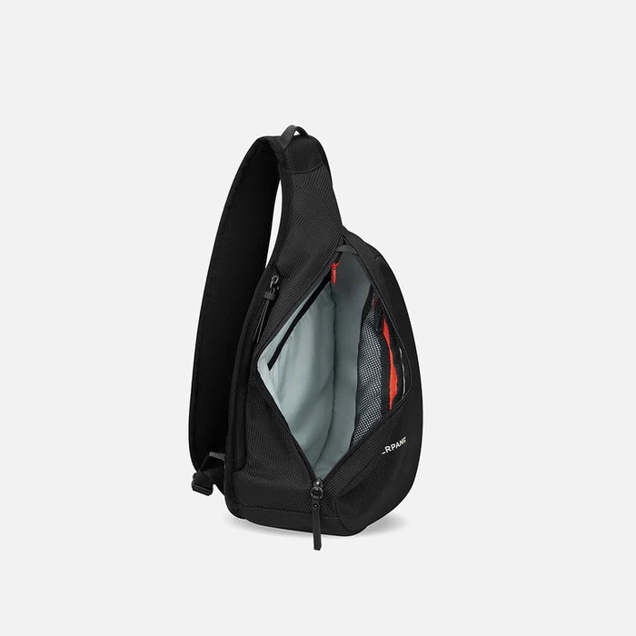 A Sherpani Esprit Carbon Black Anti-theft Sling Bag, side view showing inside main pocket on a white background.  #color_carbon-black