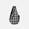 A Sherpani Esprit Houndstooth Anti-theft Sling, front view showing strap & lockable pockets on white backdrop.  #color_houndstooth-print