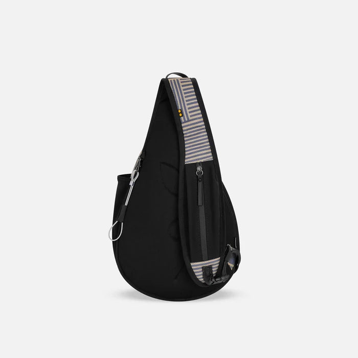 A Sherpani Esprit Passport Anti-theft Sling Bag, back view showing the strap pocket and the chair lock on a white background. #color_passport-print