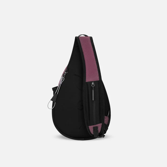 A Sherpani Esprit Smoky Orchid Anti-theft Sling Bag, back view showing the strap pocket and the chair lock on a white background. #color_smoky-orchid-pink