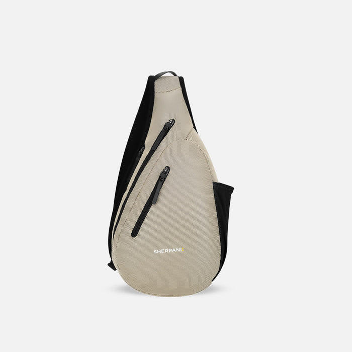 A Sherpani Esprit Straw Beige Anti-theft Sling Bag, front view showing lockable pockets and main strap on a white background. #color_straw-beige