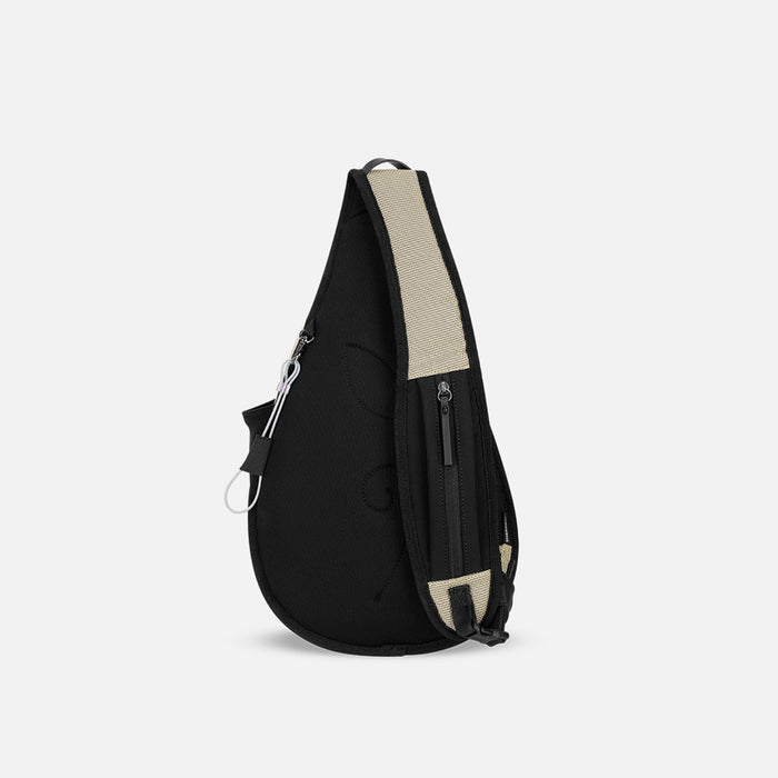 A Sherpani Esprit Straw Beige Anti-theft Sling Bag, back view showing the strap pocket and the chair lock on a white background. #color_straw-beige