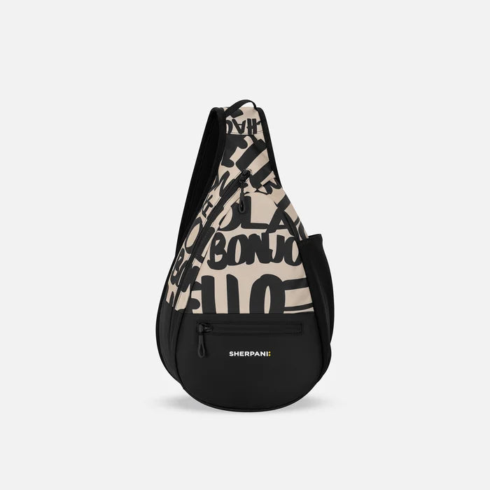 A Sherpani Esprit Ciao Sling, front view showing strap & lockable pockets on white backdrop.  #color_ciao-print
