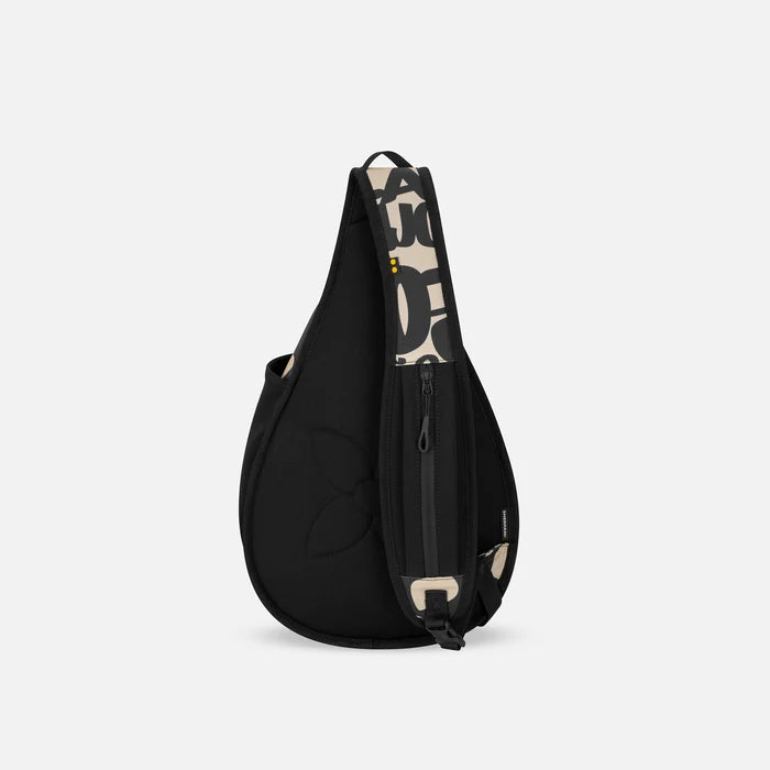 A Sherpani Esprit Ciao Sling Bag, back view showing the strap pocket and the chair lock on a white background.  #color_ciao-print
