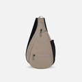 A Sherpani Esprit Dune Sling, front view showing strap & lockable pockets on white backdrop.  #color_dune-tan