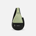 A Sherpani Esprit Palm Green Sling Bag, front view showing pockets and strap on white background. #color_palm-green