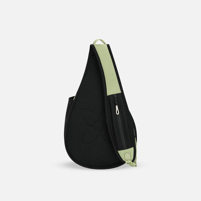 A Sherpani Esprit Palm Green Sling Bag, back view showing a pocket on the strap against a white background.   #color_palm-green