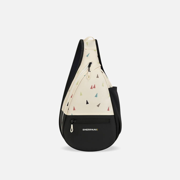 A Sherpani Esprit Terrazzo Print Sling Bag, front view showing pockets and strap on white background. #color_terrazzo-print