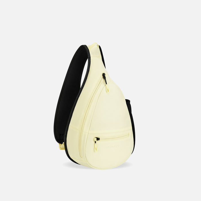 A Sherpani Esprit Sol Yellow Sling Bag, 3/4 view showing pockets and strap on white background.  #color_sol-yellow