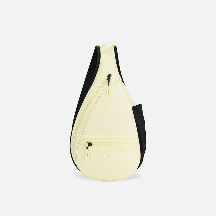 A Sherpani Esprit Sol Yellow Sling Bag, front view showing pockets and strap on white background. #color_sol-yellow