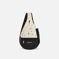 A Sherpani Esprit Terrazzo Print Sling Bag, front view showing pockets and strap on white background. #color_terrazzo-print