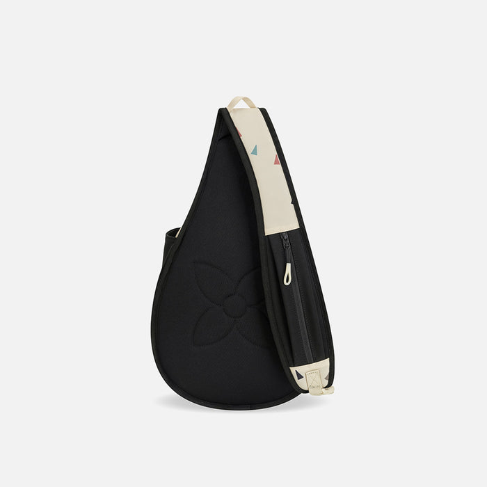 A Sherpani Esprit Terrazzo Print Sling Bag, back view showing a pocket on the strap against a white background.   #color_terrazzo-print