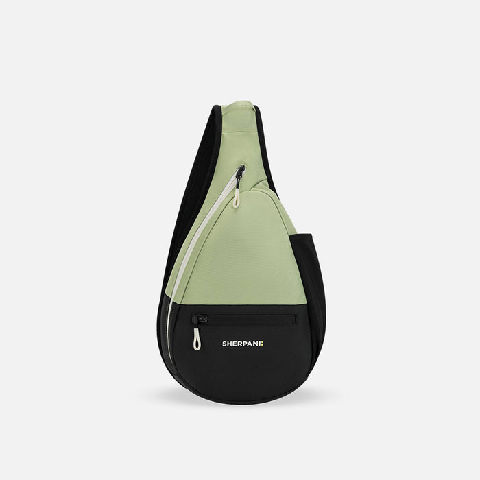 A Sherpani Esprit Palm Green Sling Bag, front view showing pockets and strap on white background. #color_palm-green