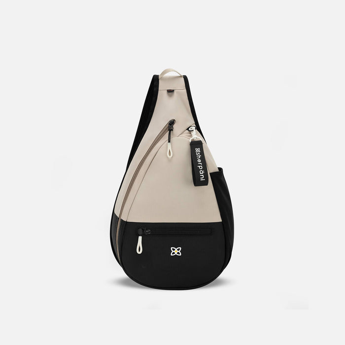 A Sherpani Esprit Con Leche Sling Bag, front view showing pockets and strap on white background.  #color_con-leche-heritage