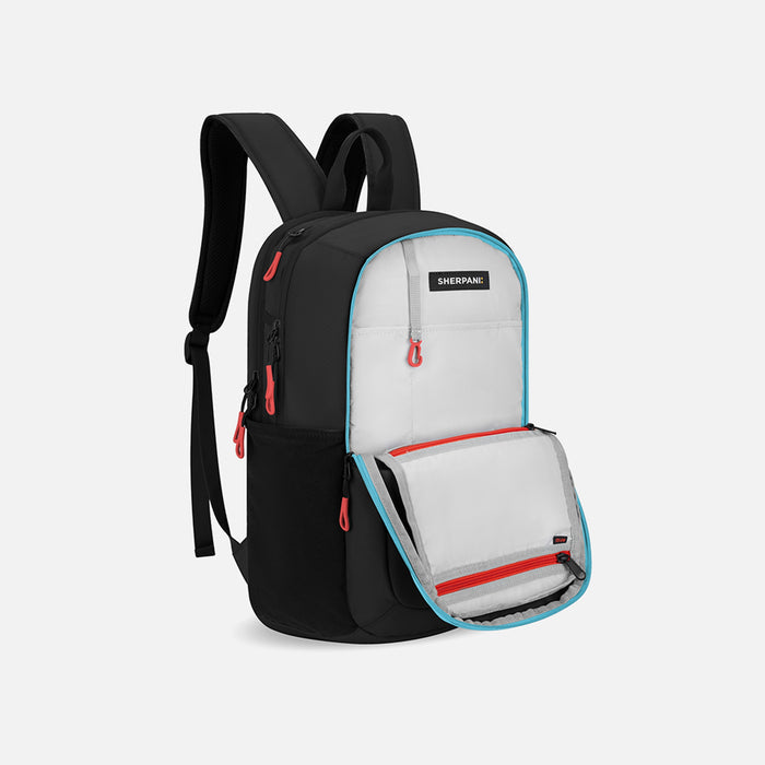 A Sherpani Getaway Chromatic Black Travel Backpack, 3/4 showing inside a pocket on white backdrop. #color_chromatic-black