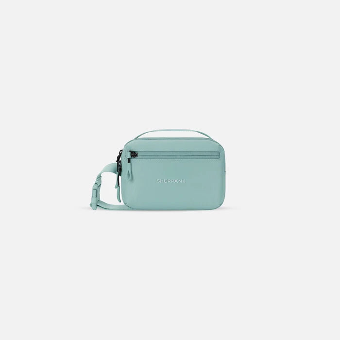 A Sherpani Hyk Surf Blue Hip Pack, front view showing pocket and straps on white backdrop.  #color_surf-blue
