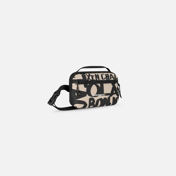 A Sherpani Hyk Ciao Hip Pack, 3/4 view showing pocket and straps on white backdrop. #color_ciao-print