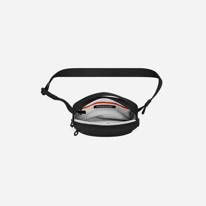 A Sherpani Hyk Raven Black Hip Pack, above view showing inside of main pocket on white backdrop. #color_raven-black