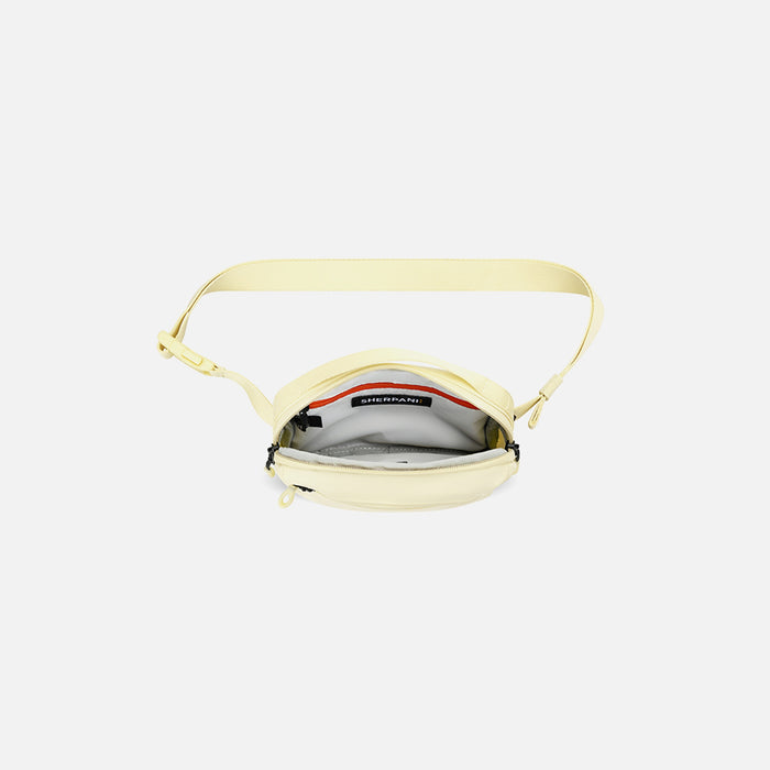A Sherpani Hyk Sol Yellow Hip Pack, above view showing inside of main pocket on white backdrop. #color_sol-yellow
