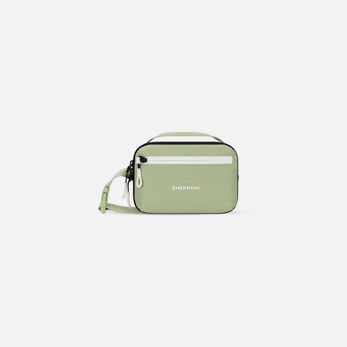 A Sherpani Hyk Palm Green Hip Pack, front view showing pocket and straps on white backdrop. #color_palm-green