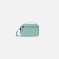 A Sherpani Hyk Surf Blue Hip Pack, front view showing pocket and straps on white backdrop.  #color_surf-blue
