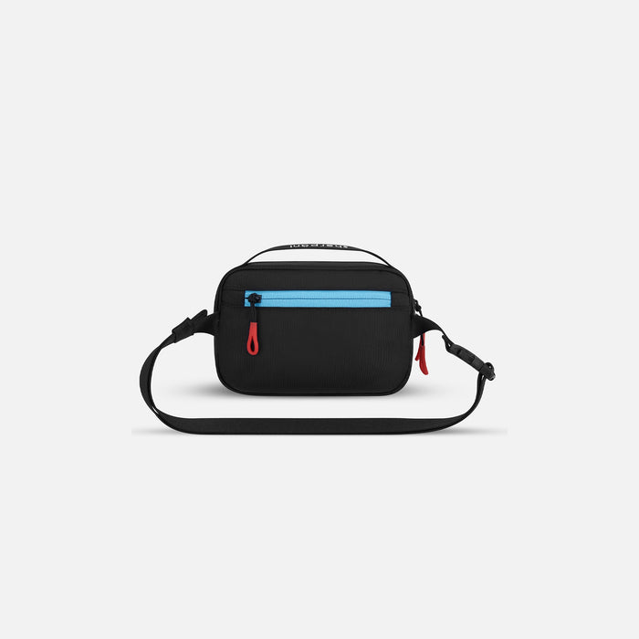 A Sherpani Hyk Chromatic Black Hip Pack, back view showing pocket and straps on white backdrop. #color_chromatic-heritage