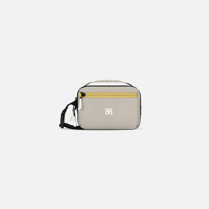 A Sherpani Hyk Wasabi Stone Hip Pack, front view showing pocket and straps on white backdrop. #color_wasabi-stone-heritage