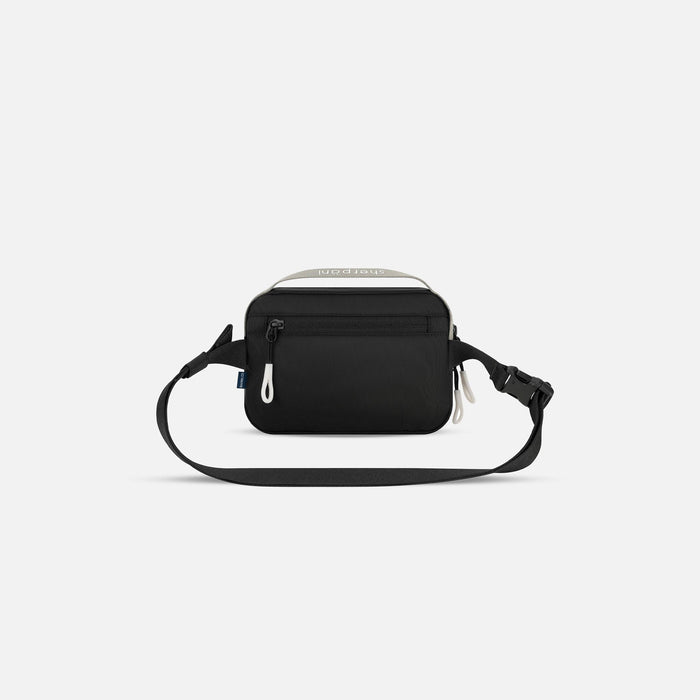 A Sherpani Hyk Wasabi Stone Hip Pack, back view showing pocket and straps on white backdrop. #color_wasabi-stone-heritage