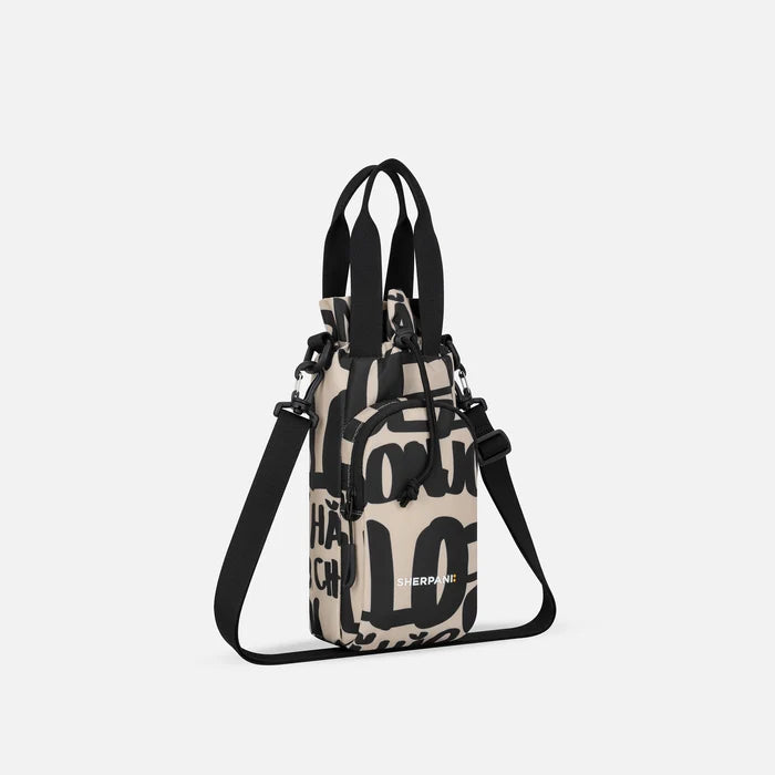 A Sherpani Izzie Ciao Water Bottle Crossbody, 3/4 view showing strap and front pocket on white background.  #color_ciao-print
