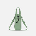 A Sherpani Izzie Olivine Water Bottle Crossbody, front view showing strap and front pocket on white background.  #color_olivine-green