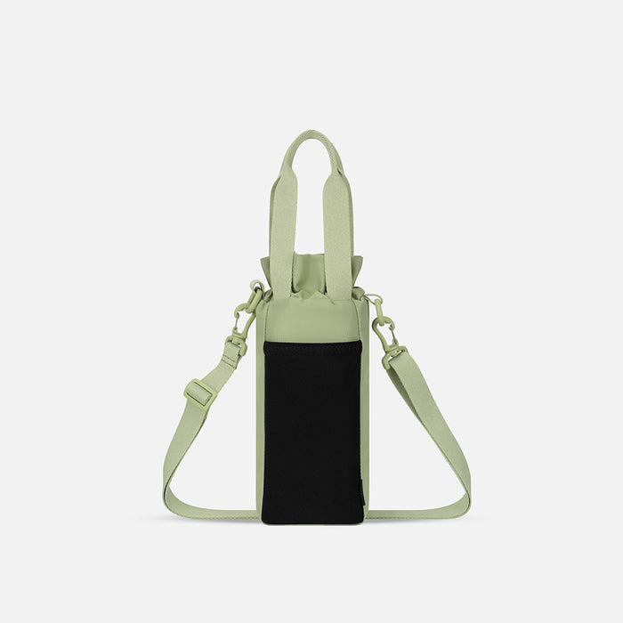 A Sherpani Izzie Palm Green Water Bottle Crossbody, back view showing strap and back pocket on white background.  #color_palm-green