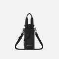 A Sherpani Izzie Raven Black Water Bottle Crossbody, front view showing strap and front pocket on white background.  #color_raven-black