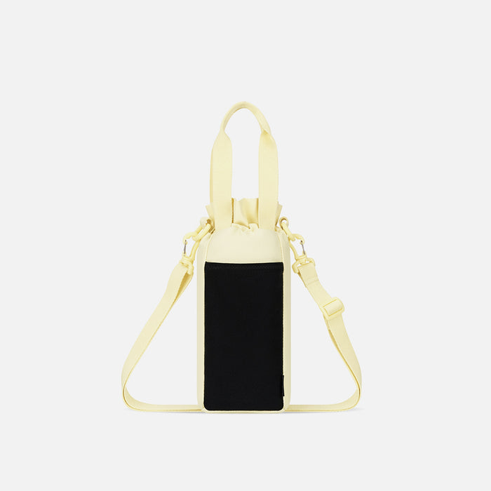 A Sherpani Izzie Sol Yellow Water Bottle Crossbody, back view showing strap and back pocket on white background.  #color_sol-yellow