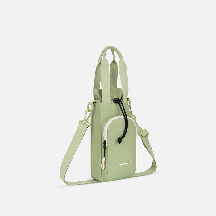 A Sherpani Izzie Palm Green Water Bottle Crossbody, 3/4 view showing strap and front pocket on white background.  #color_palm-green