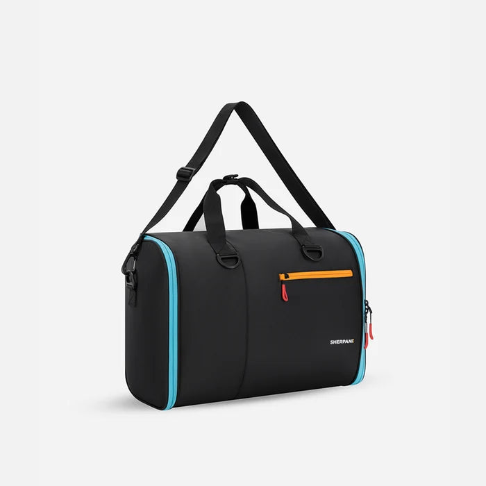 A Sherpani Jaunt Chromatic Black Garment Duffle, 3/4 view showing two strap options on white backdrop. #color_chromatic-black