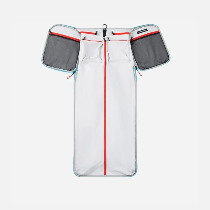 A Sherpani Jaunt Chromatic Black Garment Duffle, above unzipped view showing foldable packing pockets on white backdrop. #color_chromatic-black