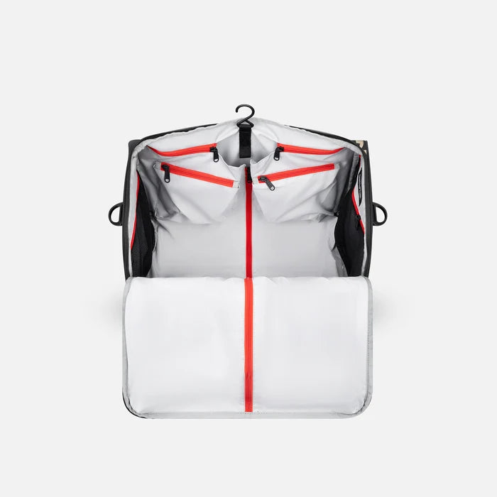 A Sherpani Jaunt Ciao Garment Duffle, back view showing straps & luggage strap on white backdrop. #color_ciao-print