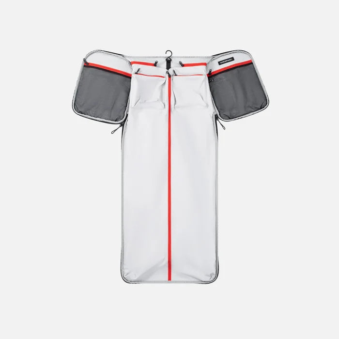 A Sherpani Jaunt Ciao Garment Duffle, above unzipped view showing foldable packing pockets on white backdrop. #color_ciao-print