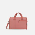 A Sherpani Jaunt Desert Pink Garment Duffle, front view showing straps & lockable pocket on white backdrop.   #color_desert-pink