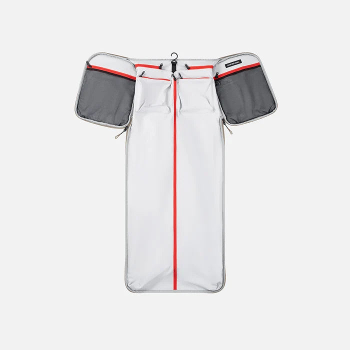 A Sherpani Jaunt Dune Garment Duffle, above unzipped view showing foldable packing pockets on white backdrop. #color_dune-tan