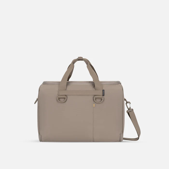 A Sherpani Jaunt Dune Garment Duffle, back view showing straps & luggage strap on white backdrop. #color_dune-tan