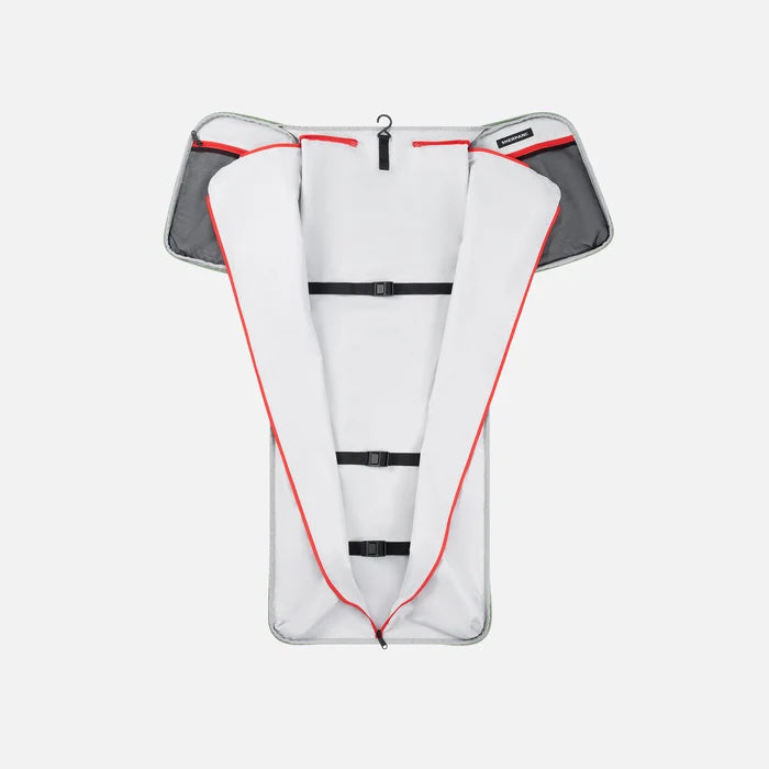 A Sherpani Jaunt Olivine Garment Duffle, above unzipped view showing foldable packing pockets on white backdrop. #color_olivine-green