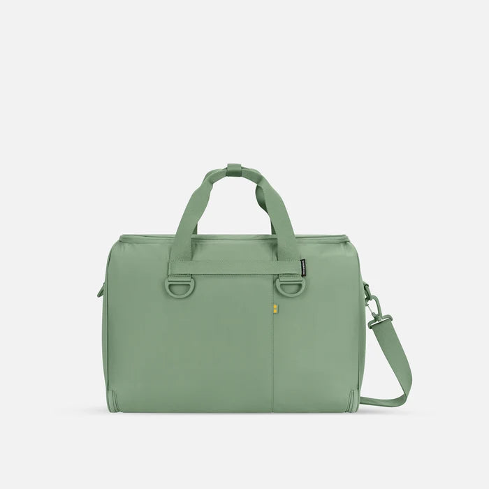 A Sherpani Jaunt Olivine Garment Duffle, back view showing straps & luggage strap on white backdrop.     #color_olivine-green
