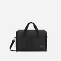 A Sherpani Jaunt Raven Black Garment Duffle, front view showing straps & lockable pocket on white backdrop.   #color_raven-black