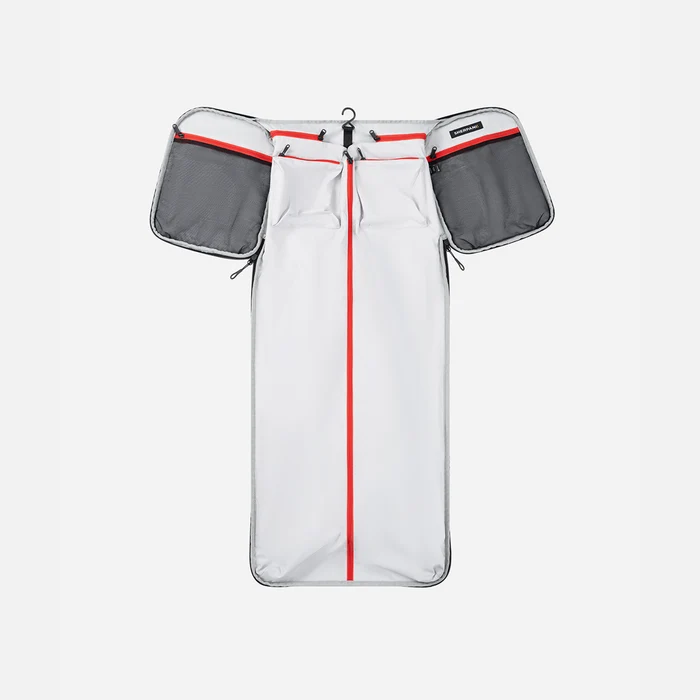 A Sherpani Jaunt Raven Black Garment Duffle, above unzipped view showing foldable packing pockets on white backdrop. #color_raven-black