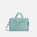 A Sherpani Jaunt Surf Blue Garment Duffle, front view showing straps & lockable pocket on white backdrop.   #color_surf-blue