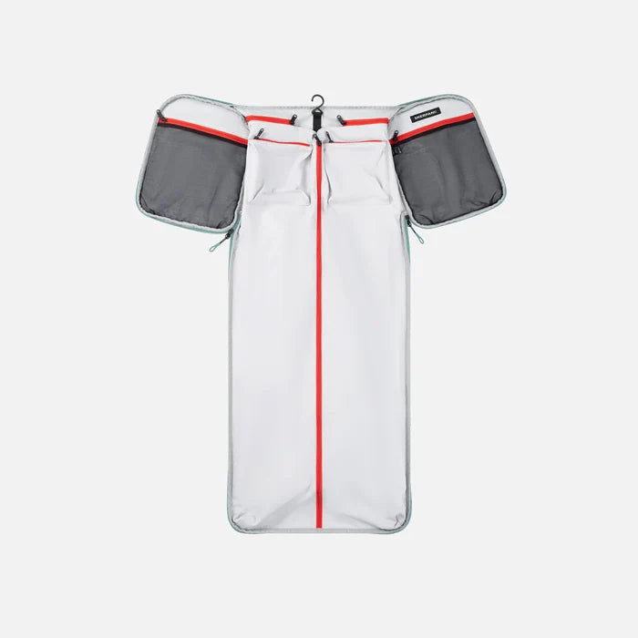 A Sherpani Jaunt Surf Blue Garment Duffle, above unzipped view showing foldable packing pockets on white backdrop. #color_surf-blue