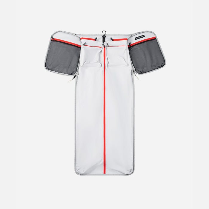 A Sherpani Jaunt Terrazzo Print Garment Duffle, above unzipped view showing foldable packing pockets on white backdrop. #color_terrazzo-print