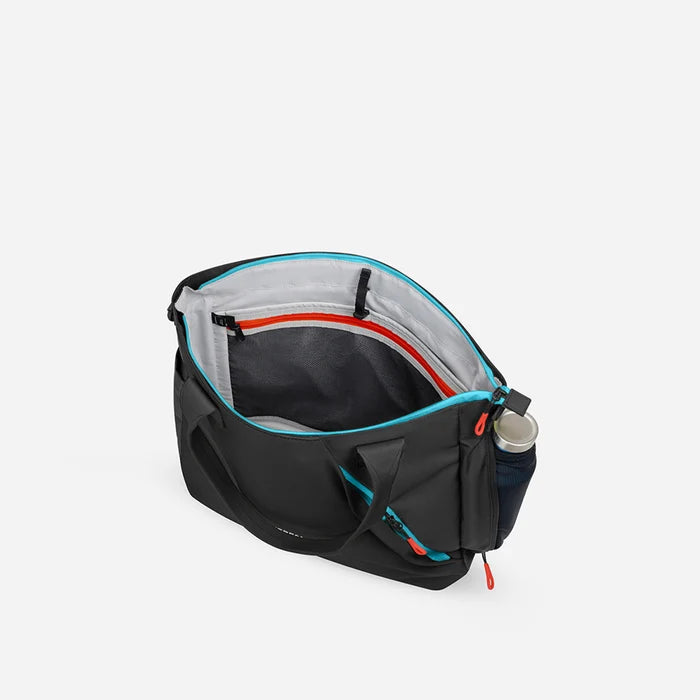 A Sherpani Jetsetter Chromatic Black Travel Tote Bag, above view showing inside pockets on white backdrop.  #color_chromatic-black